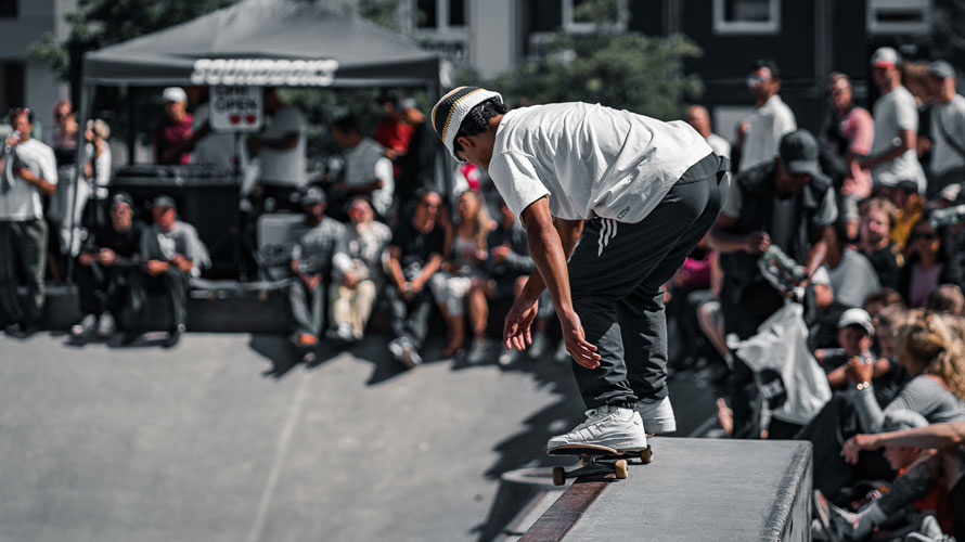Skateboarder surrounded by the audience during a competition