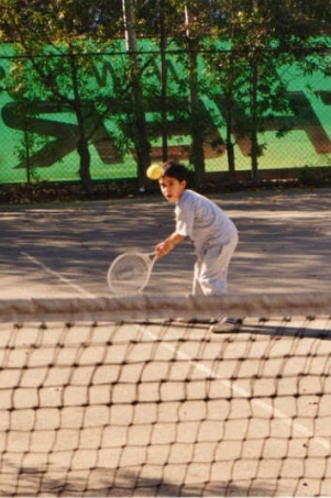Leonidas Christofides playing tennis as a kid