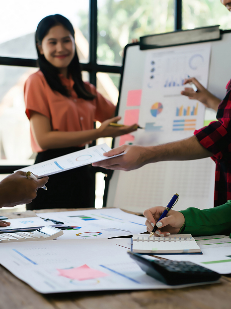 Team members reviewing charts and graphs during a strategic planning meeting