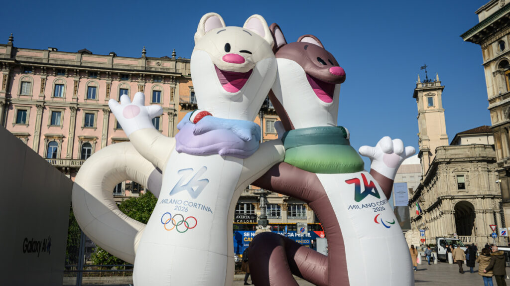 Tina and Milo, the Olympic and Paralympic mascots of Milano Cortina 2026, displayed in a public square in Milan.
