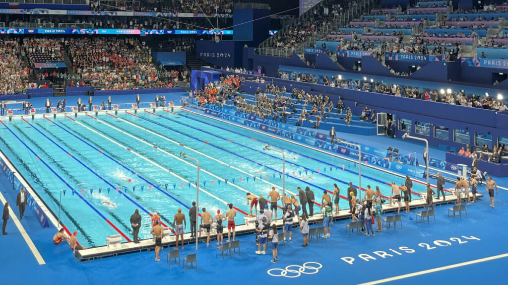 Swimming competition at the Paris 2024 Olympic Games, showcasing a modern venue designed to support sustainable sports events.